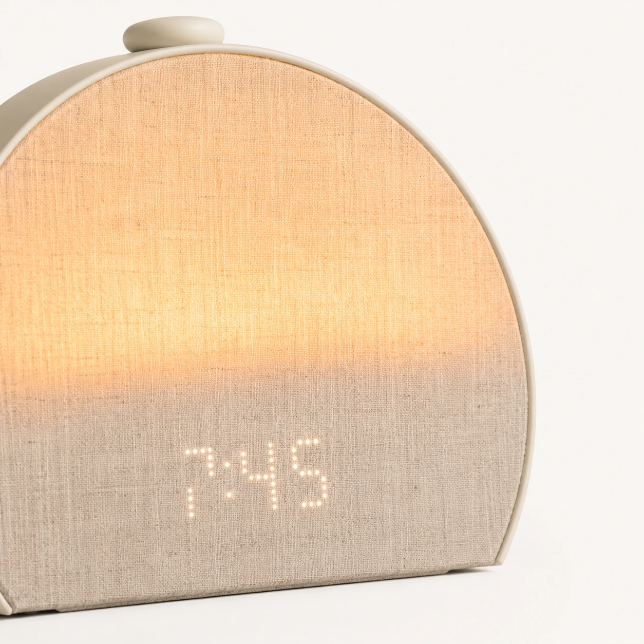Hatch Restore 3 Smart Sunrise Alarm Clock showing a soft sunrise-style glow Hatch Restore 3 Smart Sunrise Alarm Clock showing a soft sunrise-style glow